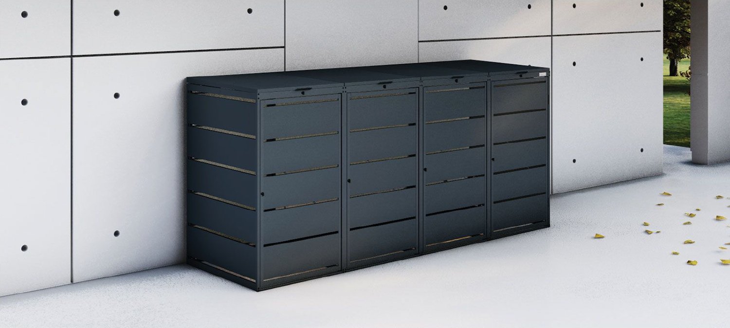 Prima BOX 4er-Mülltonnenbox in Anthrazit auf einem gepflasterten Vorplatz